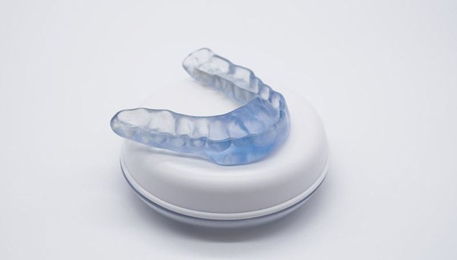 Nightguard sitting on top of its storage case