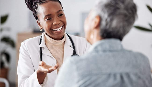 a patient speaking with a sleep physician about her sleep apnea treatment options