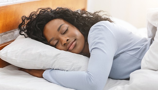 a woman getting a restful night of sleep